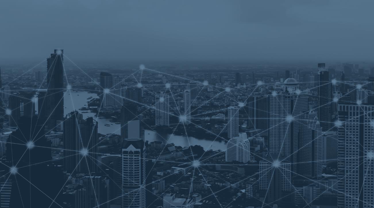 City skyline at dusk with network connectivity nodes overlaid - representing Ontel's capacity to fill coverage gaps for events and private networks